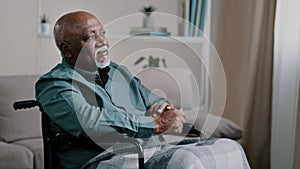 Pensive dreaming calm alone elderly patient. old African bald man with gray beard senior mature grandpa sit on