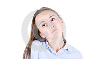 Pensive dreamy young woman looking up isolated on white wall background studio portrait