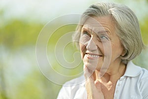 Pensive elderly woman