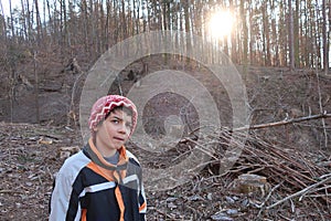 Pensive expression. Autistic child on a forest pass.