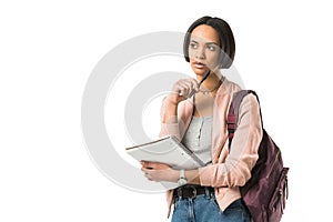 pensive female african american student with backpack and copybook photo