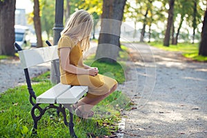 Pensive girl child alone in park