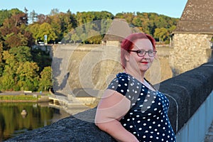 Pensive girl with red hair at Möhnesee