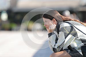 Pensive girl wearing sweater looking away