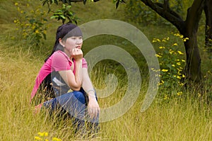 A pensive girl with weeds