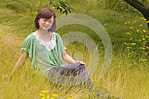 A pensive girl with weeds