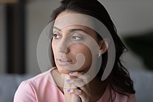 Pensive indian arab woman look in distance thinking