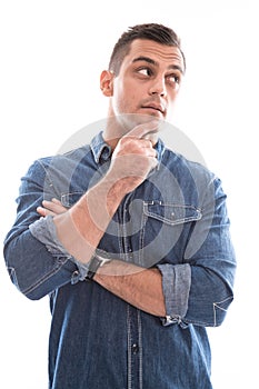 Pensive isolated attractive man over white.