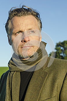 Pensive looking mature man with beard