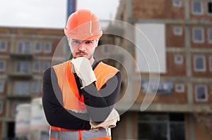 Pensive male engineer outside in front of building