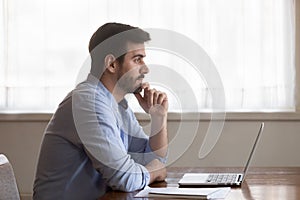 Pensive male look in distance thinking of problem solution