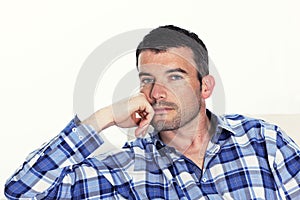 Pensive man with blue shirt