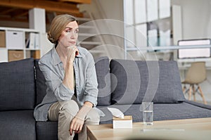 Pensive Mature Woman at Home