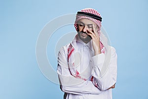 Pensive muslim man in thoughts