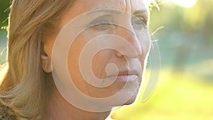 Pensive old woman thinking about life, plastic surgery and botox, face closeup