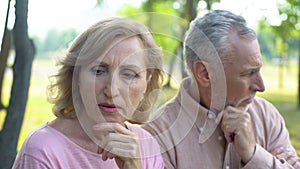 Pensive pensioners thinking of problem, crisis in relations, aged couple divorce photo