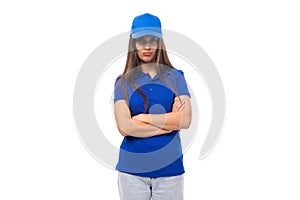 pensive pretty young brunette woman in blue cap and t-shirt with mockup for print on white background with copy space