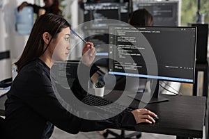 Pensive programmer thinking at ideas trying to write code