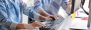 Pensive programmer working on on desktop pc programming code technologies or website design at office Software Development Company