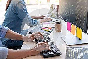Pensive programmer working on on desktop pc programming code technologies or website design at office Software Development Company