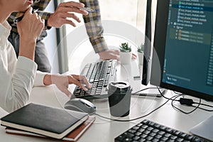 Pensive programmer working on desktop pc programming code technologies or website design at office Software Development Company