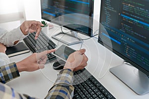 Pensive programmer working on desktop pc programming code technologies or website design at office Software Development Company