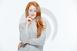 Pensive redhead woman