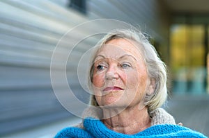 Pensive senior lady with a speculative expression photo