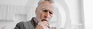 pensive senior man with alzheimer disease