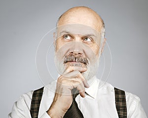 Pensive senior man portrait