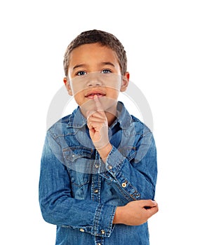 Pensive small child with denim t-shirt
