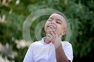 Pensive small child with white shirt