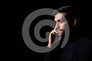 Pensive thinking handsome young beard man portrait Attractive bearded confident guy planning something looking at blank space