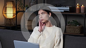 Pensive Woman Author With Laptop On Sofa