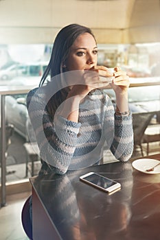 Pensive woman at the bar