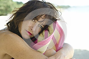 Pensive woman on beach