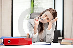 Pensive woman with big notepad