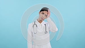 pensive woman doctor with headache over blue background