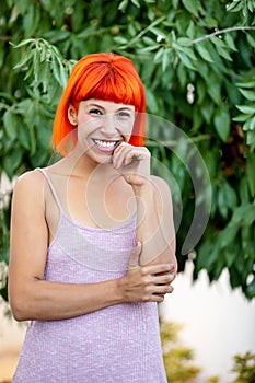 Pensive woman with red hair enjoing a relaxed day