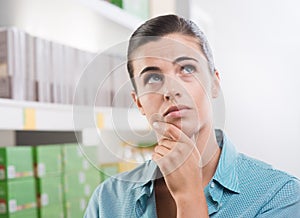 Pensive woman at store