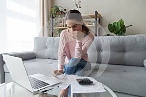 Pensive woman thinking managing family utility bills