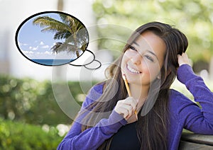 Pensive Woman with Tropical Scene Inside Thought Bubble