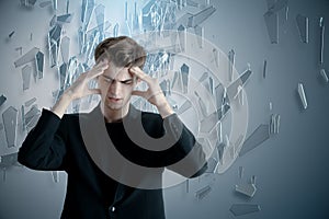 Pensive businessman on abstract background