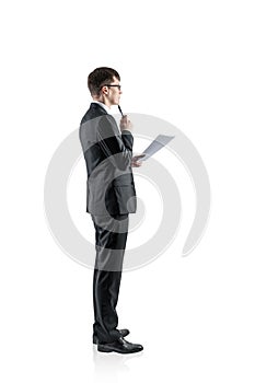Pensive young businessman with document