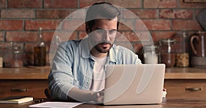 Pensive young businessman thinking of problem solution.