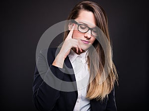 Pensive young caucasian businesswoman in formal wear