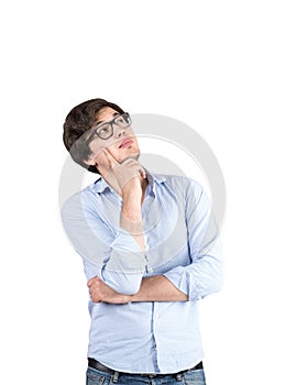 Pensive young man in glasses, isolated