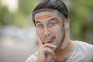 Pensive young man outdoors