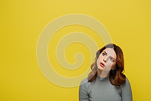 pensive young woman with curly hair