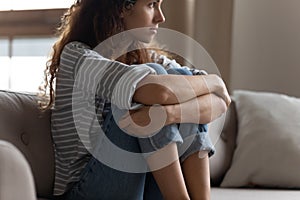 Pensive young woman look in distance thinking